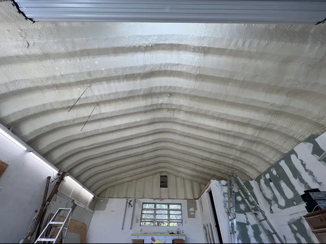 Spray polyurethane foam applied to the underside of a metal roof deck in Diamondhead